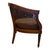 An elegant vintage barrel-back armchair combining sculptural carved wood with intricate woven cane. The gracefully curved...