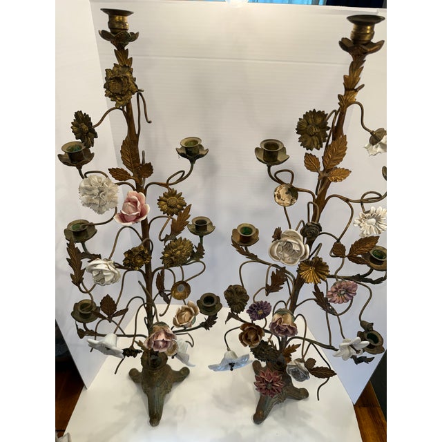 An exceptional and highly decorative pair of vintage multi-light candelabra featuring a dramatic, organic tree-form...