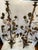 An exceptional and highly decorative pair of vintage multi-light candelabra featuring a dramatic, organic tree-form...