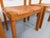 Four vintage chairs from Maison Regain, from the 1970s and 1980s. Frame and backrests are made of solid blond elm, and...