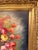 This impressive statement piece is a large oil painting on canvas depicting a vibrant floral arrangement set in a basket...