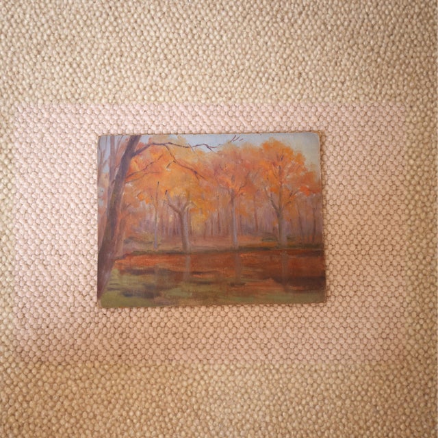 This 1938 French autumn trees painting captures the quiet beauty of a wooded landscape bathed in the warm tones of fall....