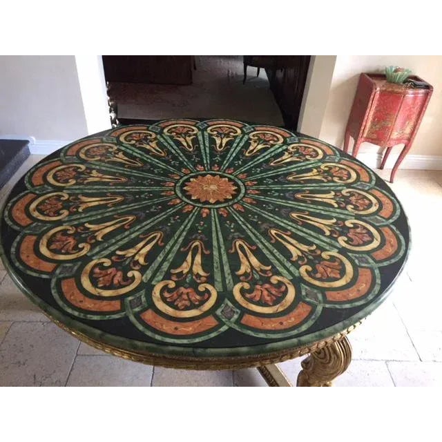 Thomas Morgan 22k carved giltwood center table with faux painted top. Made in the 1970s.