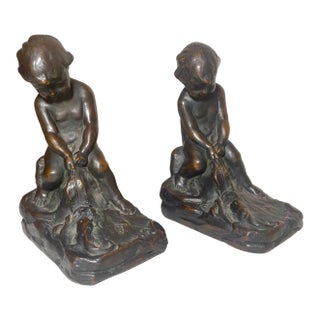 Pair of 2 Antique Patinated Bronze Clad Nude Cherub Boy With Leaf Bookends Set For Sale