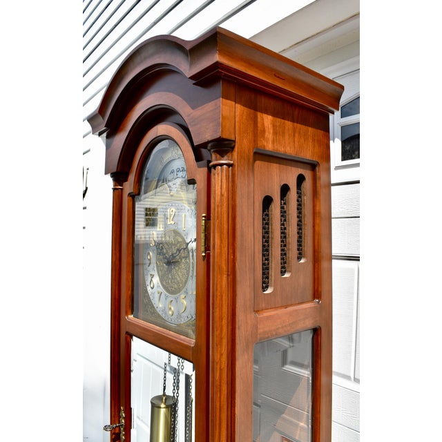 Vintage (1990's) Grandfather Clock has a Traditional Style. Made by Daneker Co. The Wood is CherryWood. The Clock has Many...