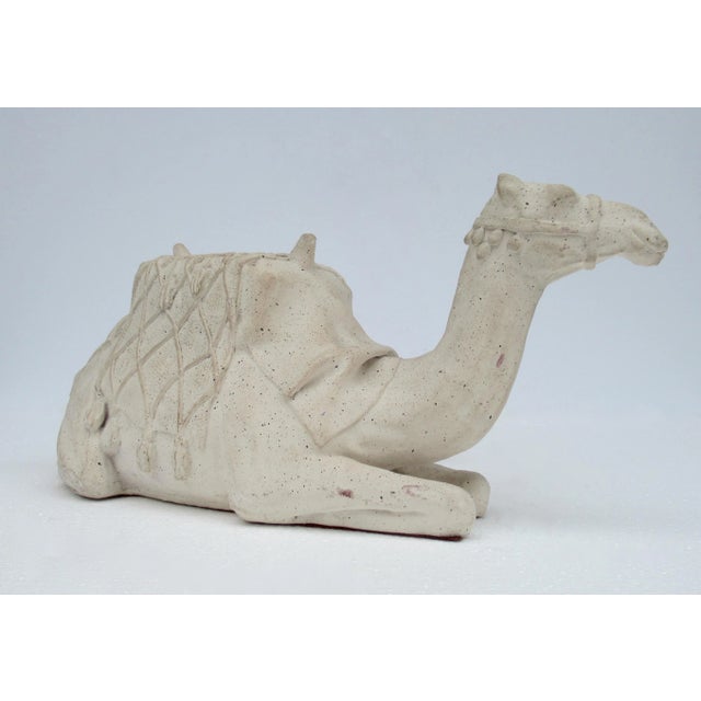 Vintage; C. 1960's ,Cement foundry molded formed Saharan Dessert camel in reposed and/or sitting position. The camel is in...