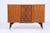 Beautiful mid-century sideboard from the 60s features * high-quality workmanship * material: wood * 3 shelves * 3 doors...