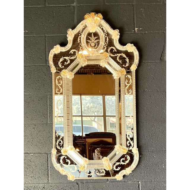 This exquisite vintage Venetian mirror is a masterclass in Italian glass artistry, capturing the timeless elegance and...