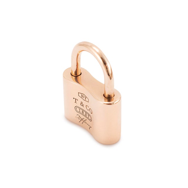Brand: Tiffany & Co. Length: 0.75 inches Width: 5.20 mm Weight: 7.45 grams Tiffany &amp; Co. One ladies Lock modern-style,...