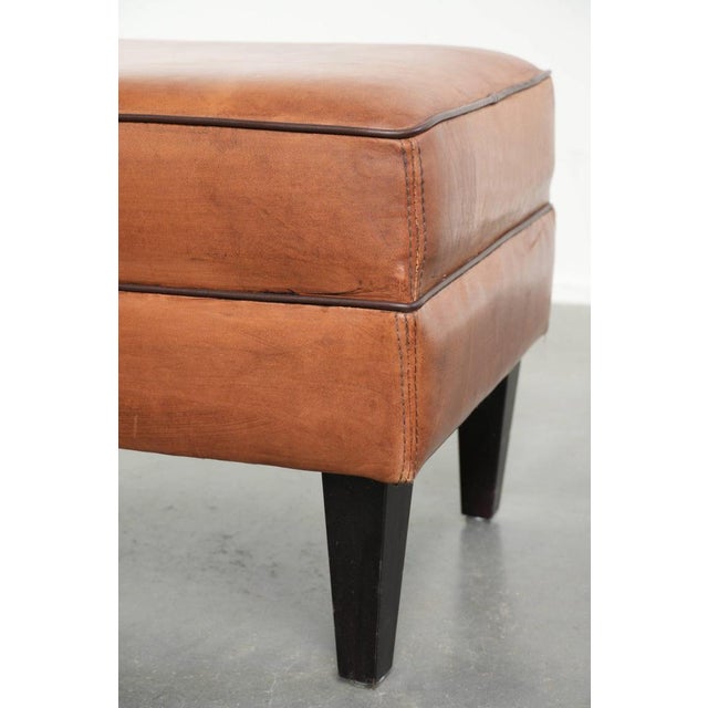 Brown Vintage Sheepskin Ottoman with Black Piping For Sale - Image 8 of 10