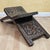 This vintage folding stool, marked “Hecho En Honduras Ca” underneath, showcases traditional Honduran wood carving with...