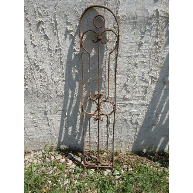A piece of architectural salvage from a victorian iron gate. Heavy and sturdy. Piece does show signs of age related wear...