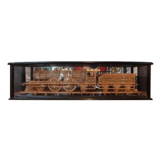 Carved Wood Model of a Locomotive in Black Lacquered and Glass Case For Sale