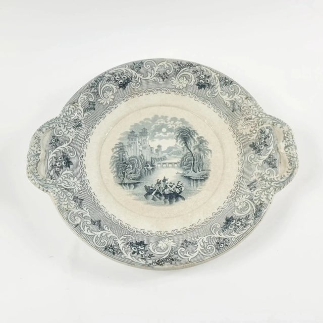 Large antique ceramic serving plate/centerpiece made by an English manufacturer and decorated with the classic...