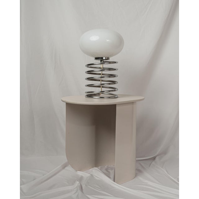 Wonderful Spiral table lamp in the style of Designer Ingo Maurer, Germany, 1970s. Great shape with a white glass shade on...