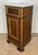 Elegant pair of Spanish nightstands featuring white marble tops, a single upper drawer, and lower cabinet doors with...