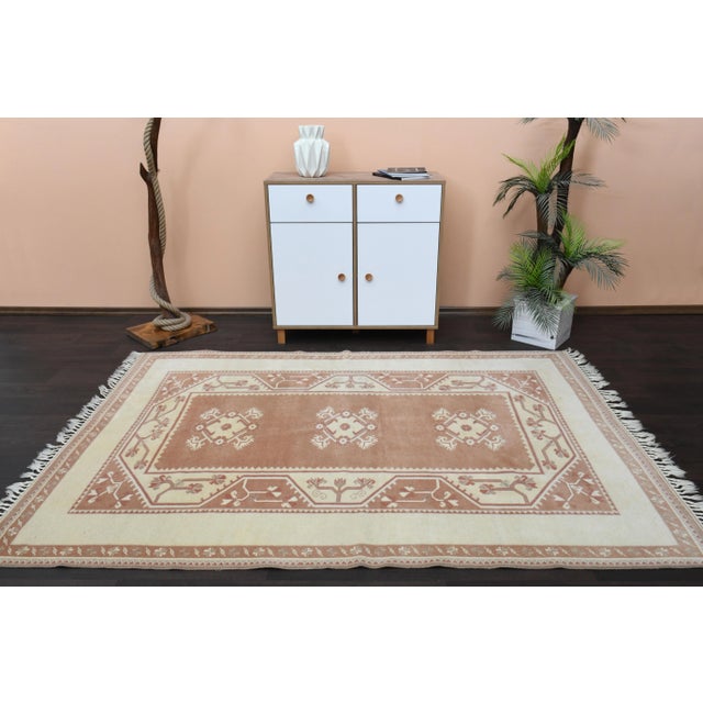 Vintage Turkish Hand-Knotted vintage rug is a semi-antique vintage area rug.'70s Eastern region of Turkey's unique rug is...