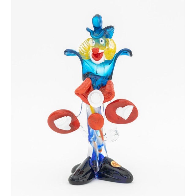 Group of Two Murano Art Glass Clown Sculptures, one with "Made in Murano Italy" label to shoe. Larger: 10.5" H x 6" W x...