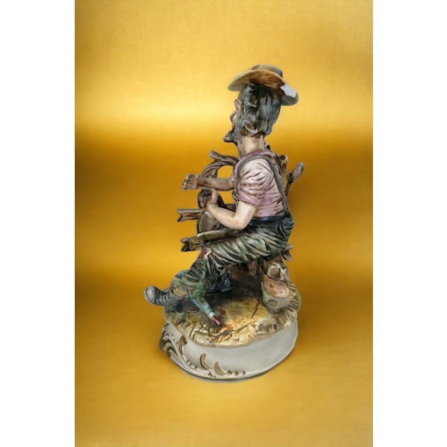 Statue of Man with Broken Umbrella from Capodimonte, in Flawless conditions. Designed 1970 to 1979 This piece has an...