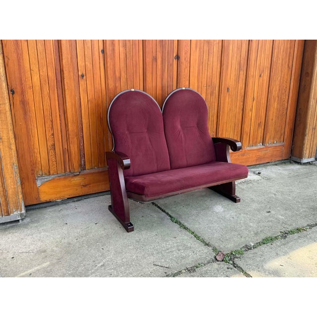Elegant vintage two-seater loveseat featuring distinctive Art Deco design elements. The beautifully shaped high backrests...