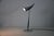 The ara table lamp was designed by philippe starck for flos in 1988 and is a striking example of postmodern lighting...