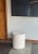 A beautifully understated sculptural side table crafted from solid teak wood, defined by its clean cylindrical silhouette...