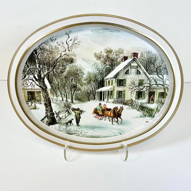 This pretty metal tray features a Currier & Ives painting from 1868 that’s entitled ‘The American Homestead, Winter.’ The...