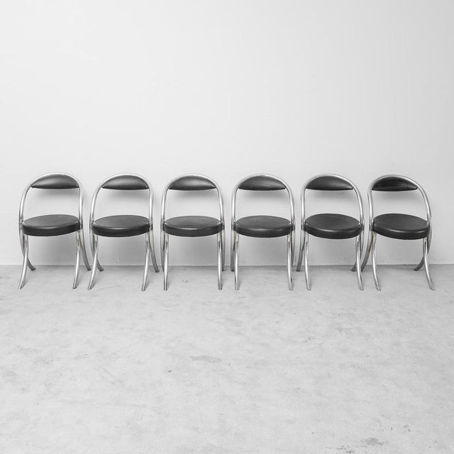 Set of 6 GIOTTO Stoppino style chairs produced in the 70s. Black eco -leather upholstery. Tubular structure in chromed...