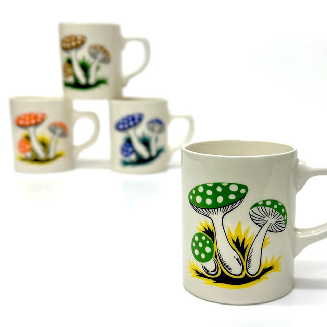 Mushroom print mugs, group of 4. An eccentric set of matching multi-colored mushroom mugs with orange, green, yellow,...