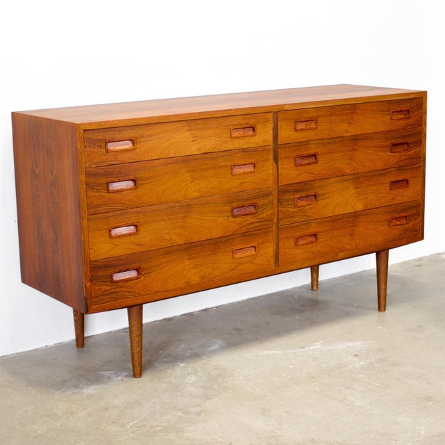 Dimensions: 54 9/16" W x 17" D x 30 7/8" H Origin: Vamdrup, Denmark Designer: Carlo Jensen Manufacturer: Hundevad & Co....
