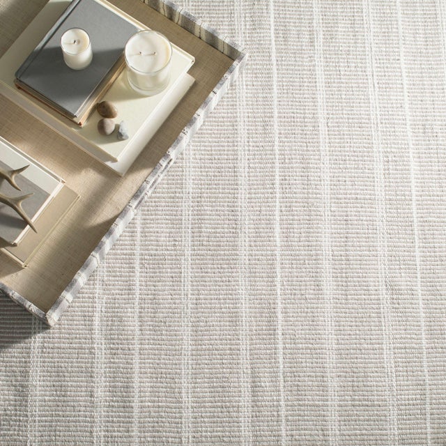 Part of our Bunny Williams collection, this delicately striped, black indoor/outdoor rug was inspired by an antique rug...