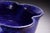 A richly glazed cobalt blue studio pottery bowl signed “Koski 2003,” featuring a striking crystalline bloom glaze and...