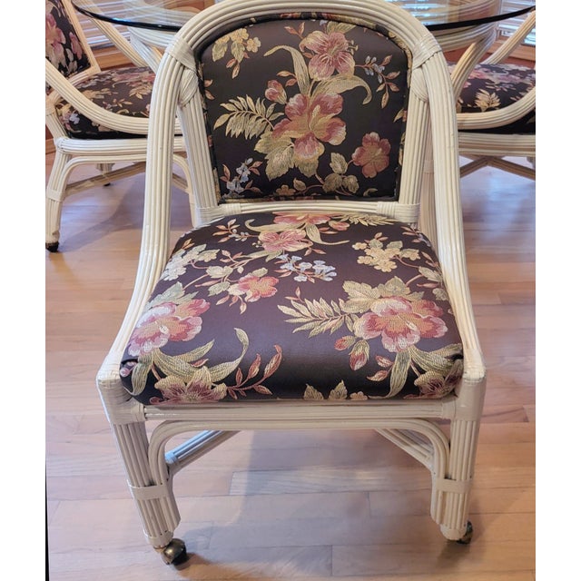 Start your day in elegance and comfort with this beautiful pencil reed bamboo breakfast table set with four chairs, by...