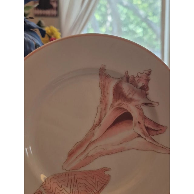 Elegant and collectible, this set of four Fitz & Floyd COQUILLE salad/dessert plates dates to 1972 and showcases the...