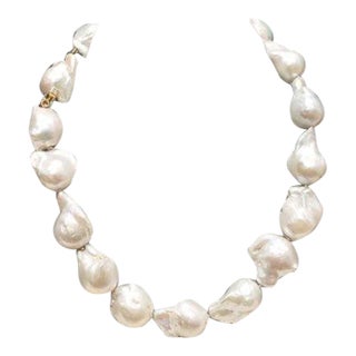 White Baroque Pearls With Pearl Push Clasp in 18k Yellow Gold and Two Princess Cut Diamonds. For Sale