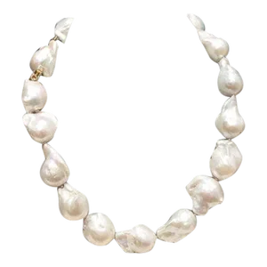 White Baroque Pearls With Pearl Push Clasp in 18k Yellow Gold and Two Princess Cut Diamonds.