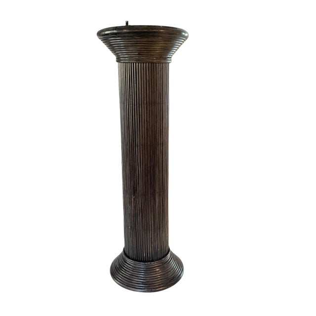 Vintage dark brown rattan pedestal - equally good for artwork or plants. C. 1970s Dimensions: 12" x 36"h