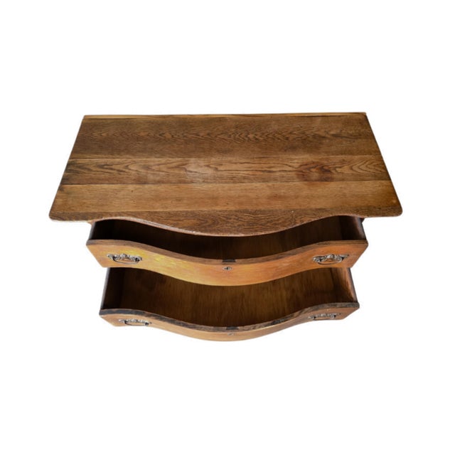 This distinguished wooden furniture ensemble captures the refined aesthetics of period craftsmanship. The dresser...