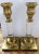 Hollywood Regency glamour. A pair of square based brass candle holders with a clear acrylic neck and a brass mouth at the...