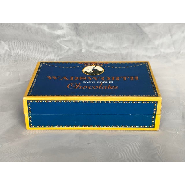 This antique Art Nouveau era chocolate box advertising Wadsworth Chocolates in Newark, New Jersey has a fabulous peacock...