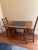 This is an early to mid 20th century tile top dining table. Oak wood and ceramic blue grouted tiles. Bought at a funky...