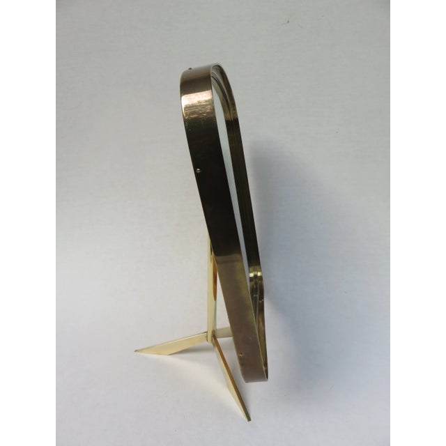 - Table mirror, 1950s - Tripod stand - Can be tilted by means of a joint - Curved shape typical of the 1950s - Mirror...