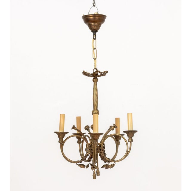 Louis XVI Style Brass Five-Branch Chandelier, with central ribbon form support and trumpet horn form arms. 29" H x 15"...