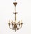 Louis XVI Style Brass Five-Branch Chandelier, with central ribbon form support and trumpet horn form arms. 29" H x 15"...