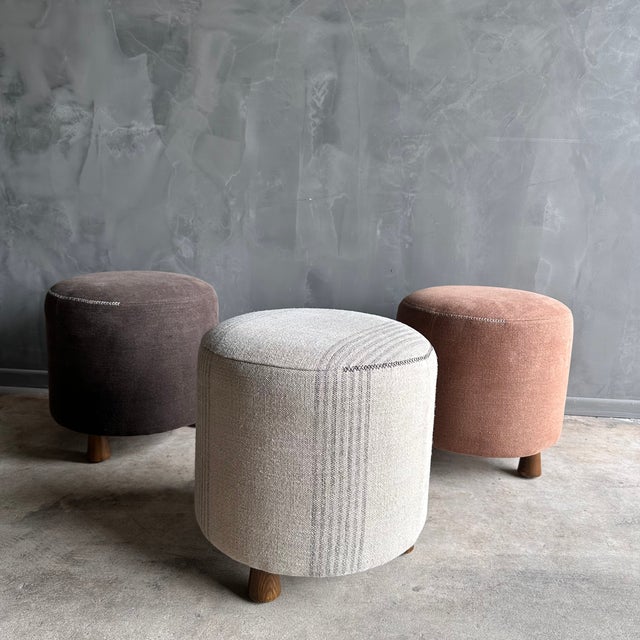 Introducing the Bailey Petite Round Ottoman, with elegant white oak legs finished in a medium tone. Covered in a...