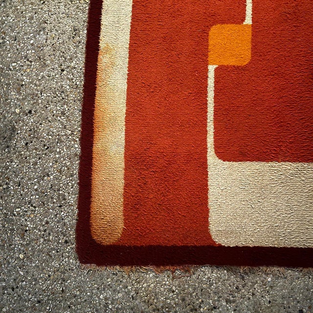 Beautiful retro rug in orange, brown and of white colors. This colourful rug fits perfectly not only in a sixties and...