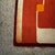 Beautiful retro rug in orange, brown and of white colors. This colourful rug fits perfectly not only in a sixties and...