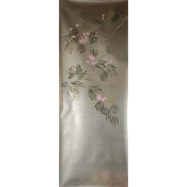 A sophisticated set of three hand-painted wallpaper panels featuring delicate botanical branches and soft pink blossoms...