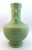 Chinese porcelain banded hu form vase, green glaze with faint white highlights on the body and interior, white glazed...
