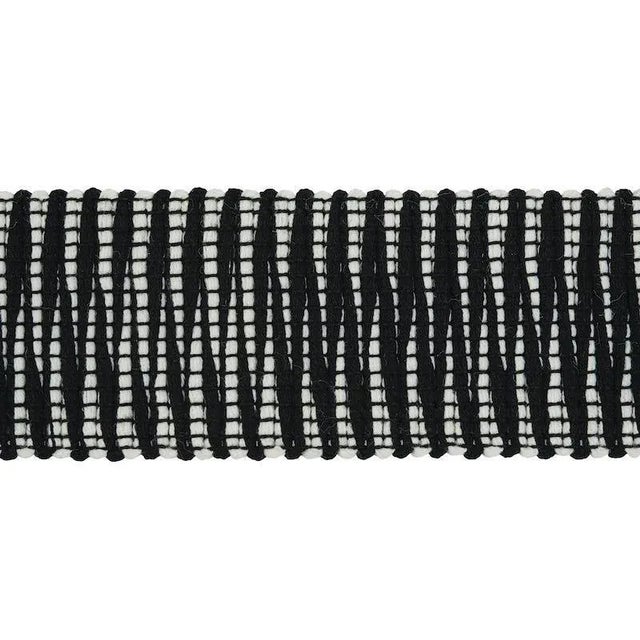 A chunky zig-zag pattern on this textured indoor-outdoor accessory achieves an excotically-inflected look for a worldly...